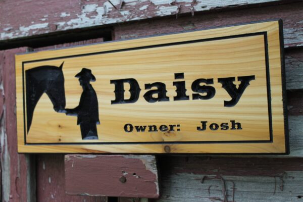 carved horse stall sign