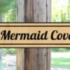 mermaid cove sign