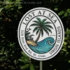 Custom vacation rental sign featuring a palm tree and wave design, perfect for personalizing your tropical getaway or beach house.